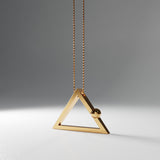 Yoga inspired gold plated silver necklace. The jewel stylises the downward facing dog pose in an essential and geometric way. It is represented by a triangle. Sliding pendant.