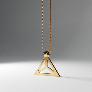 Yoga inspired gold plated silver necklace. The jewel stylises the Lotus pose in an essential and geometric way. Sliding pendant.