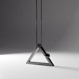 Yoga inspired rhodium plated silver necklace. The jewel stylises the Adho Mukha or dog pose and is represented by a triangle. Sliding pendant.